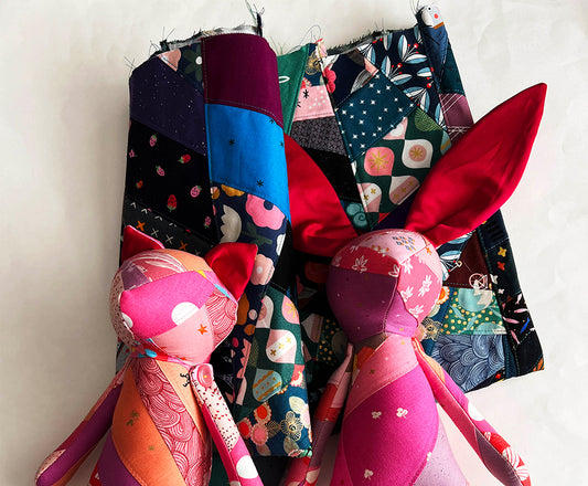 Handmade kitty and bunny stuffed animals created with pink scrappy quilt fabric